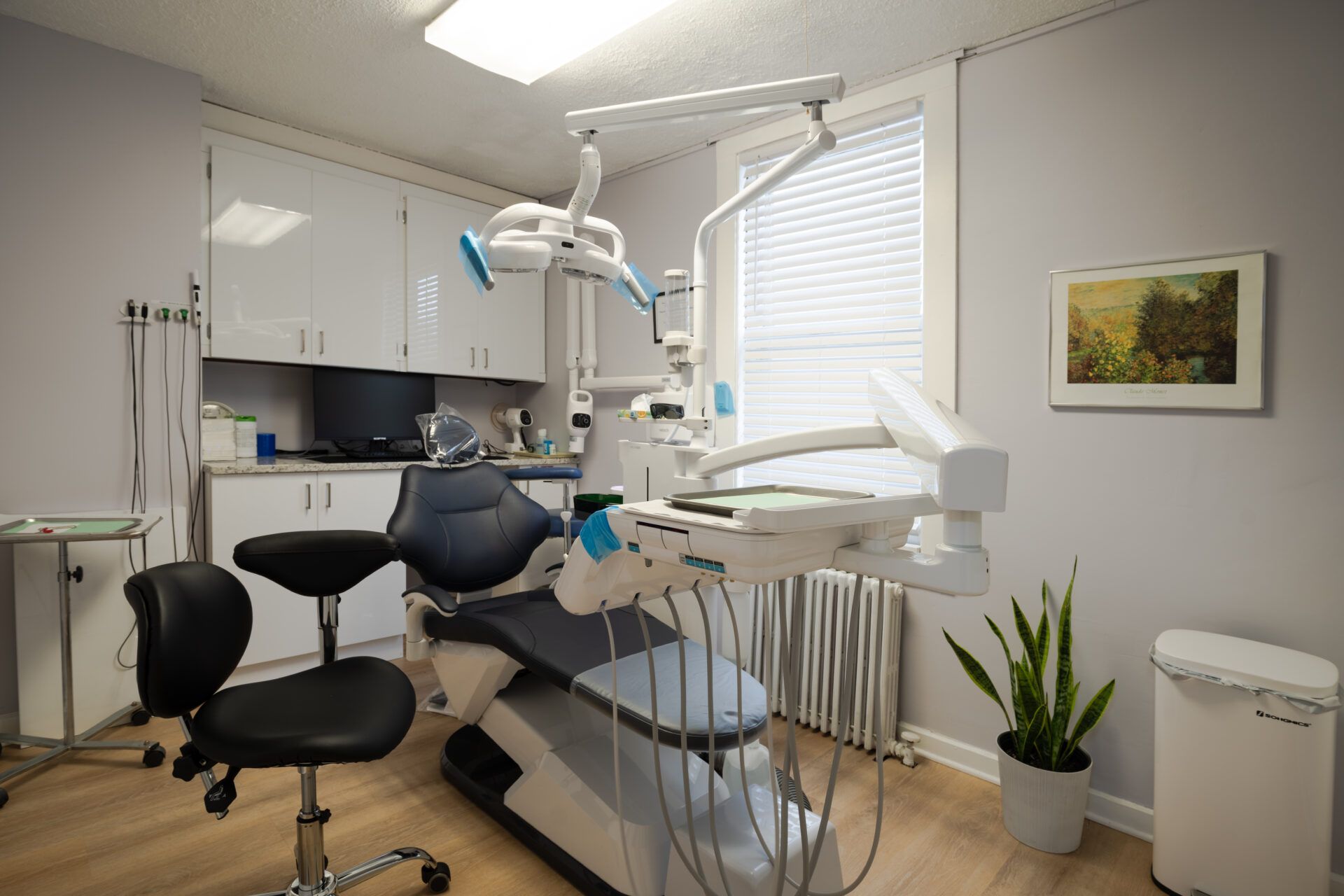 Main treatment room with dental chair and bright windows
