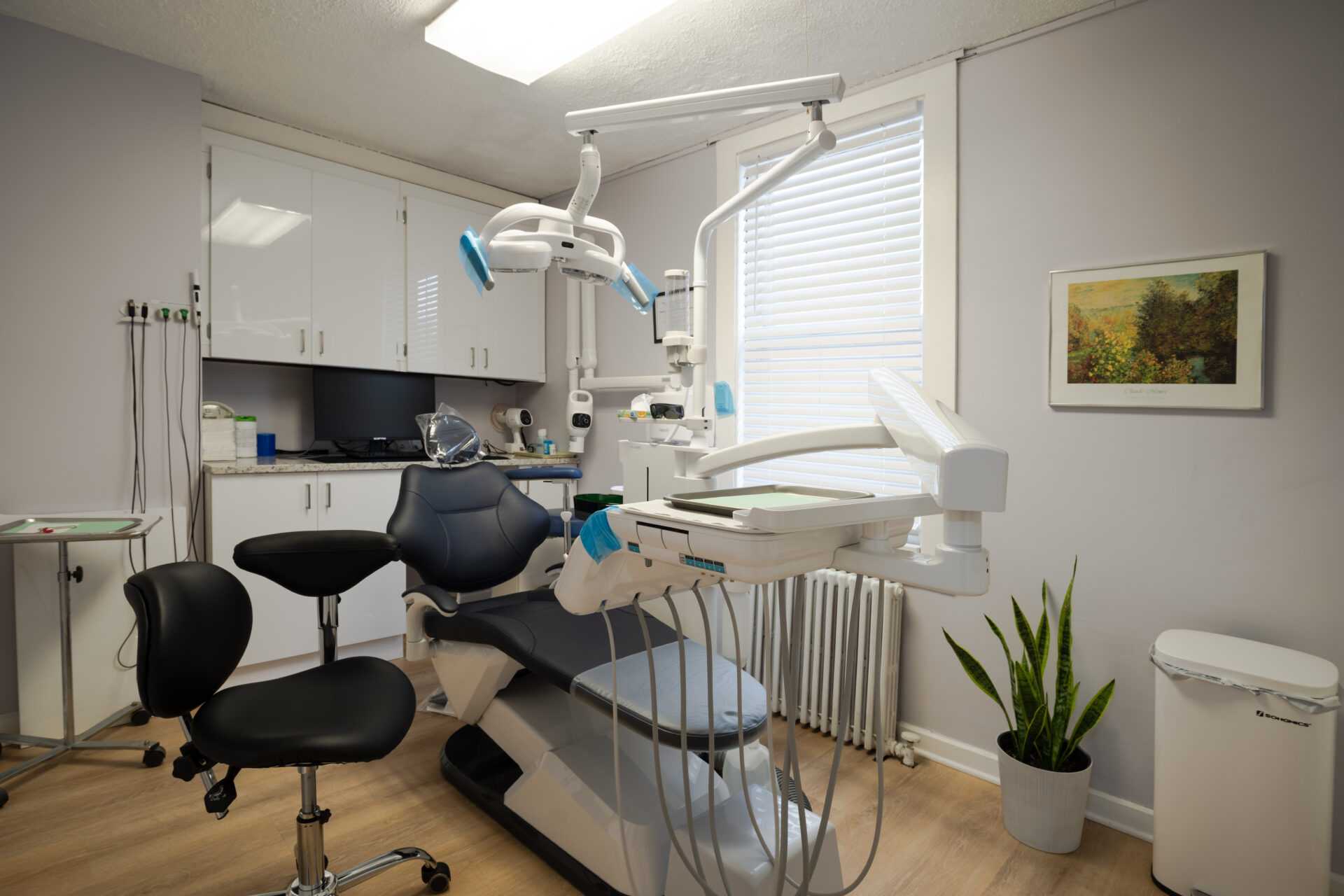 Main treatment room with dental chair and bright windows