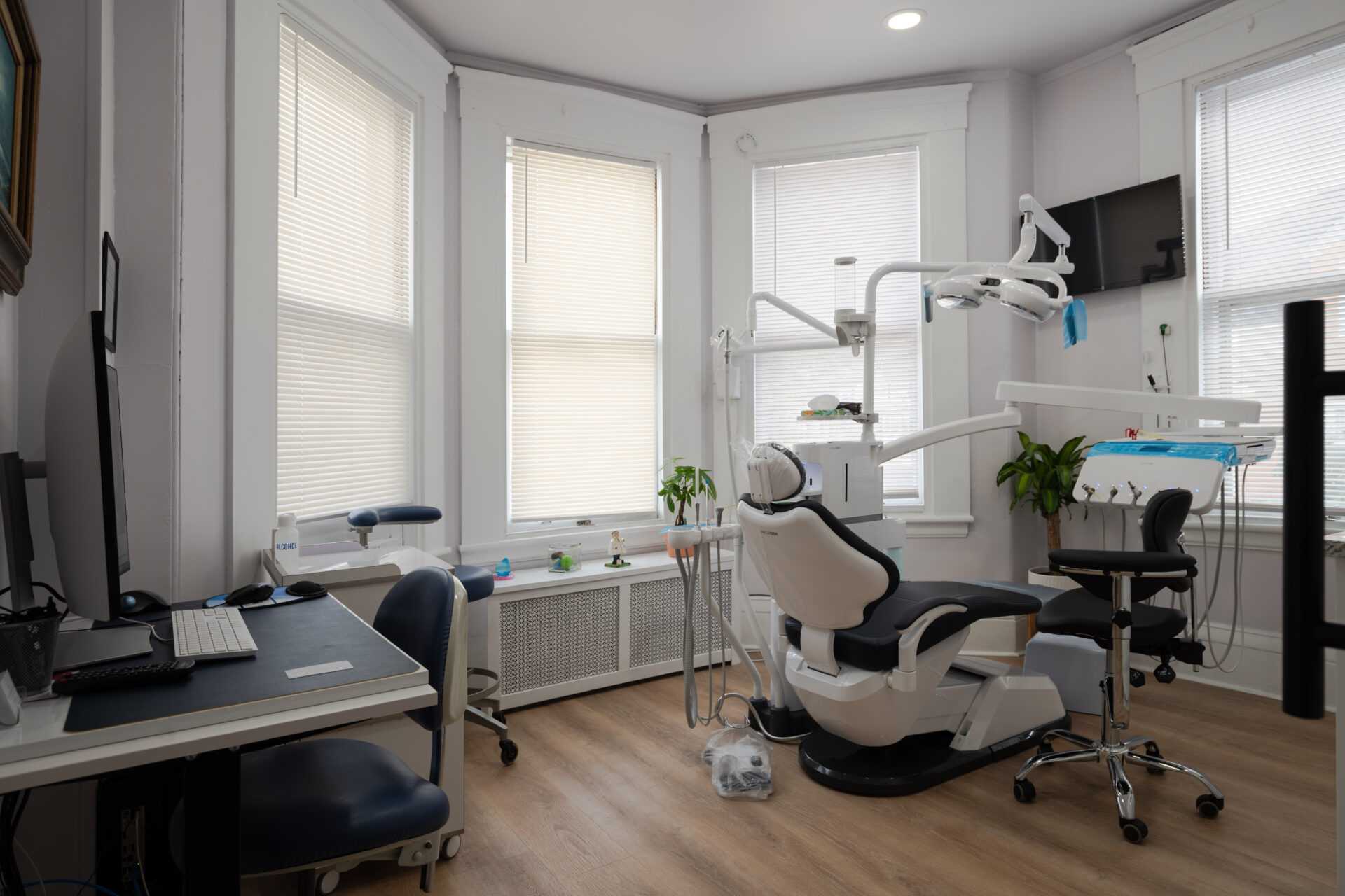 Main treatment room showing cabinetry and dental chair