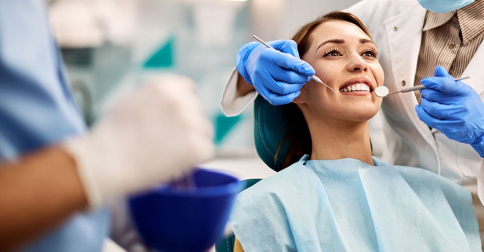 woman seated for a dentist visit
